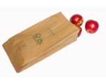 Paper produce bags with apples falling out of paper bag